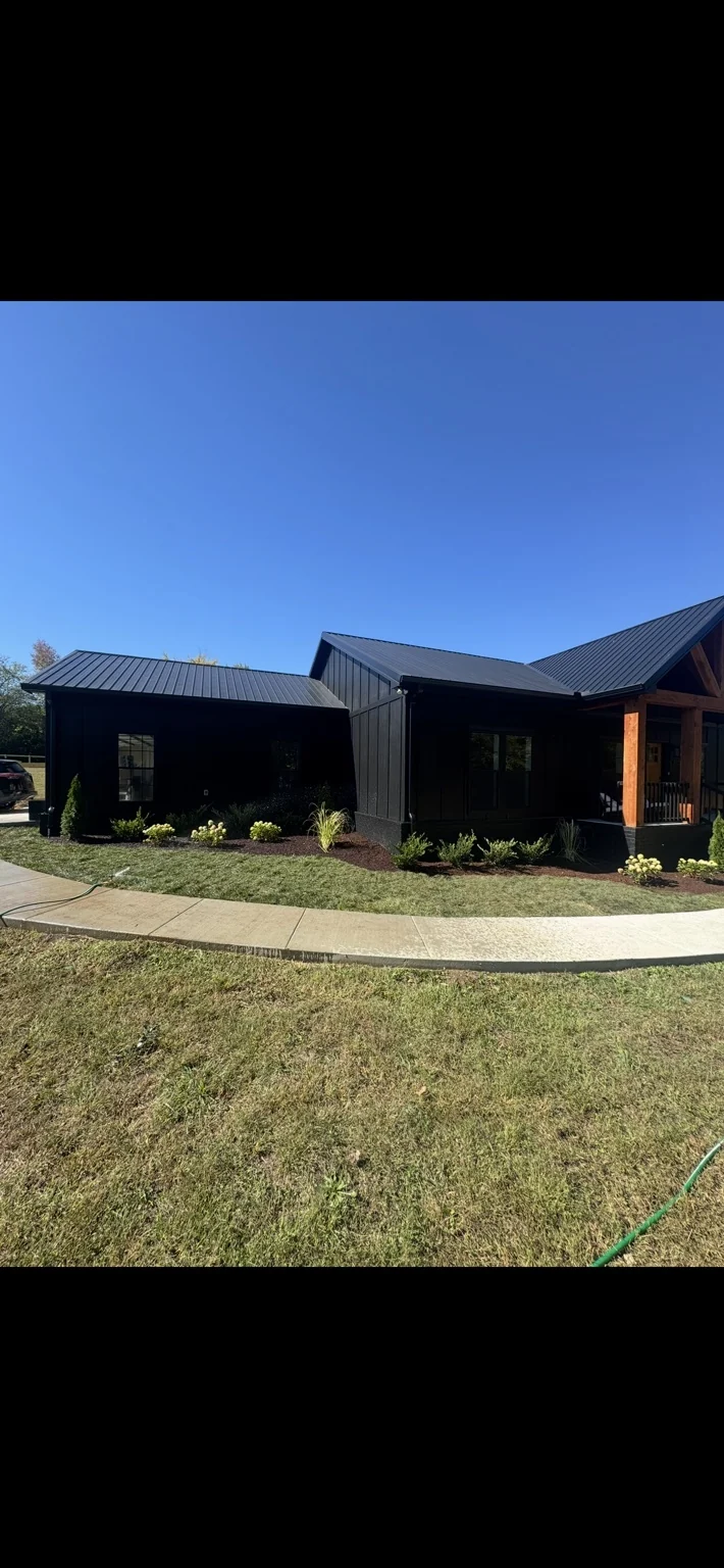 Landscaping and planting beds across the front of a home